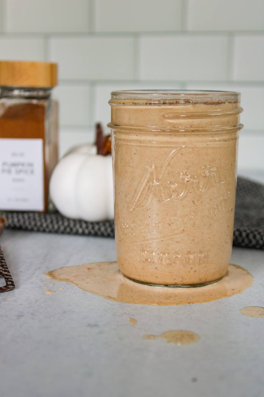 Pumpkin Spice Coffee Creamer in a mason jar with some spilled