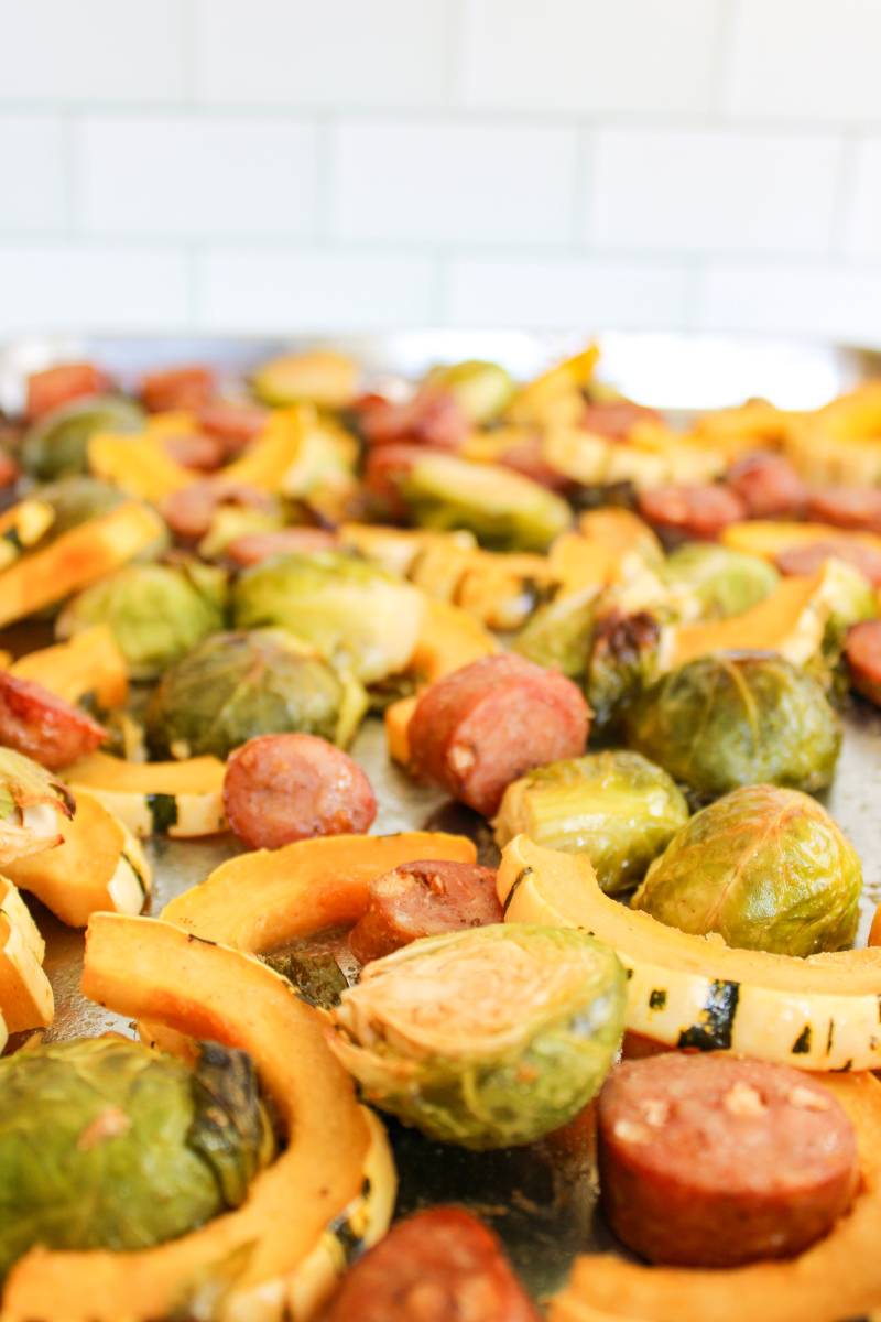 Delicata squash. brussels sprouts, and sausage on a sheet pan