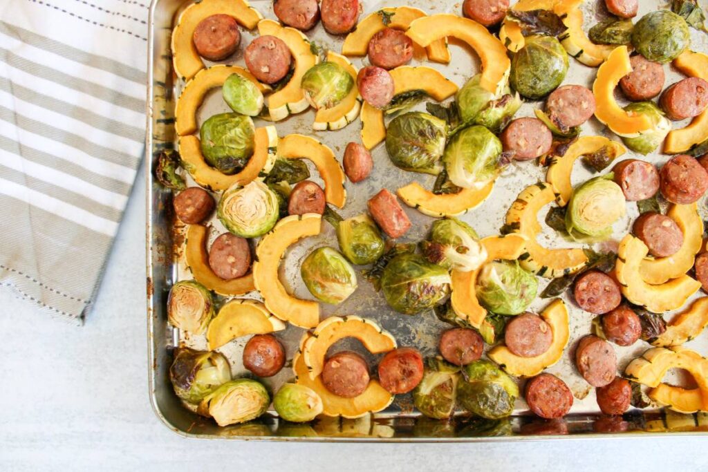 Delicata squash. brussels sprouts, sausage on a sheet pan