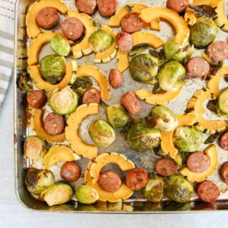 Delicata squash. brussels sprouts, sausage on a sheet pan