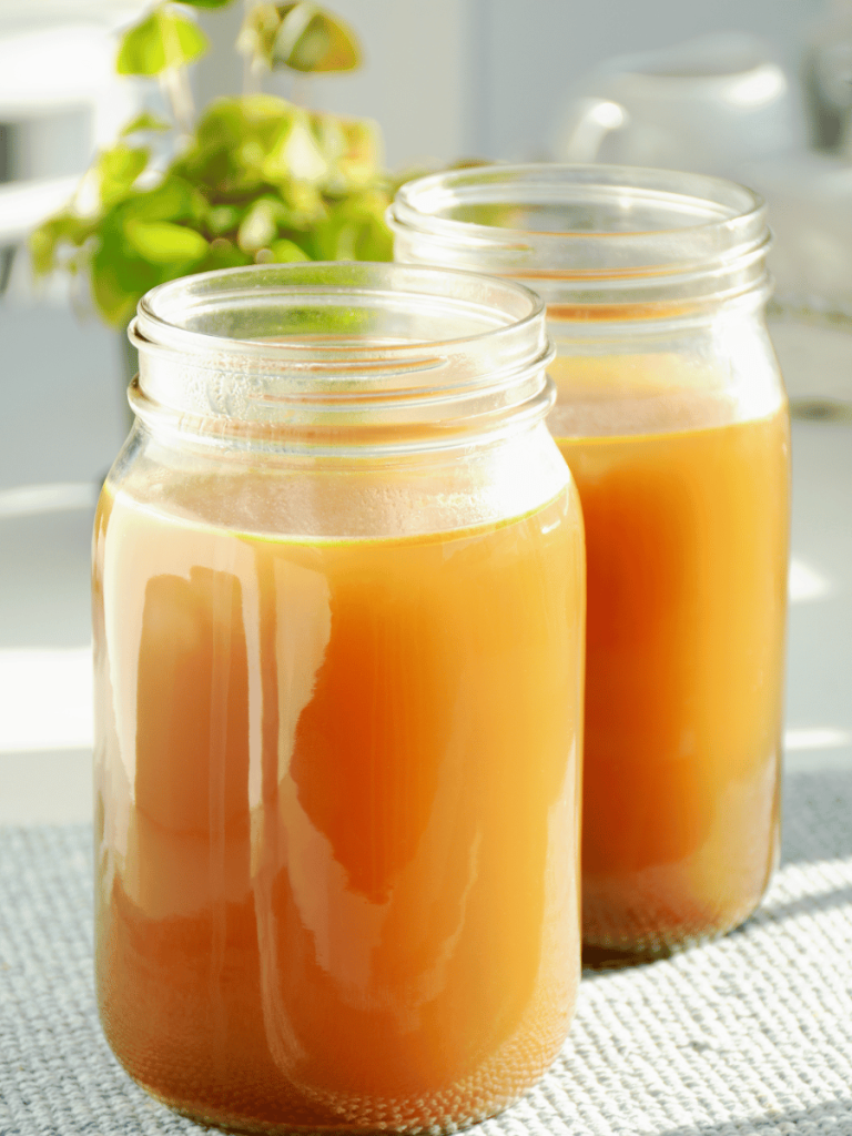 Two Mason jars filled with bone broth