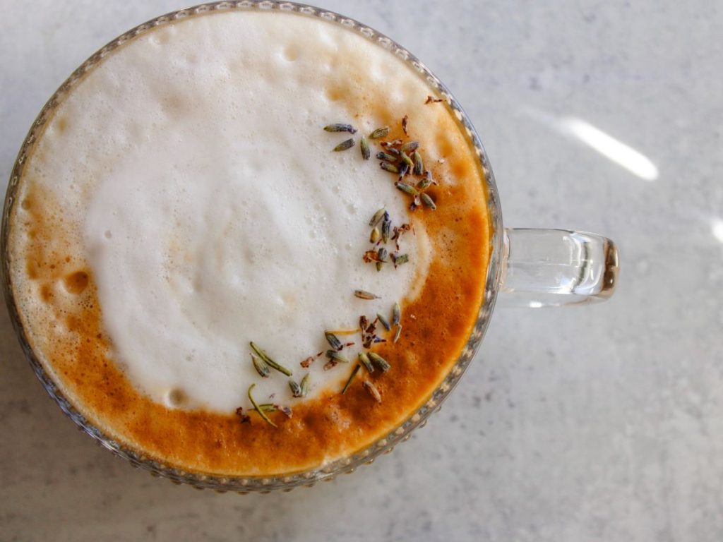 closeup on lavender latte with dried lavender on top