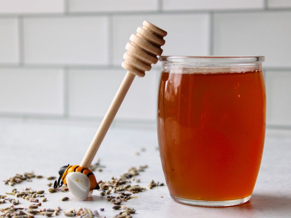 Jar of Lavender Simple Syrup with honey stick