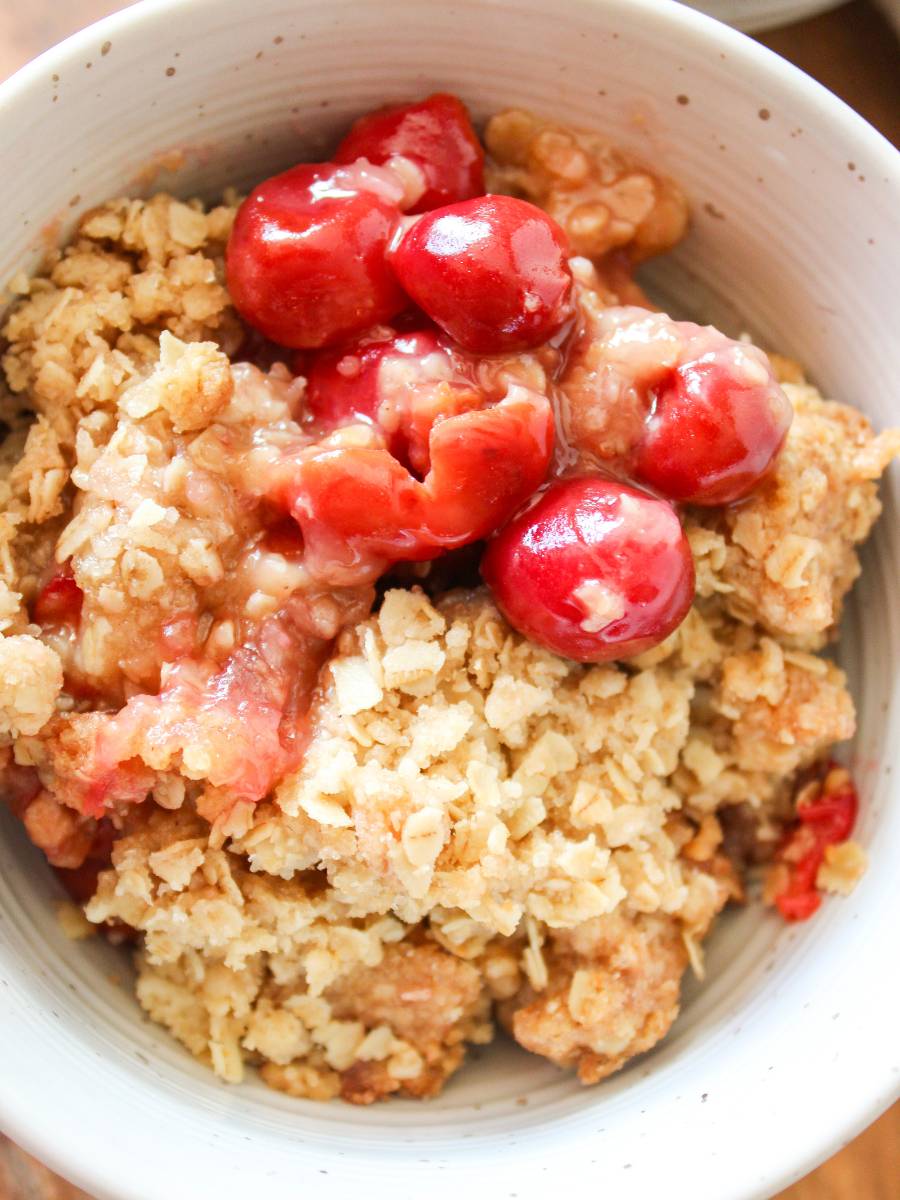 Close up on bowl of cherry crisp