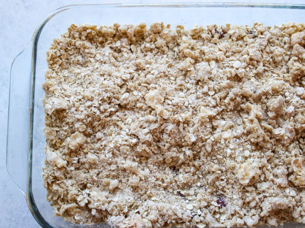 uncooked cherry crisp in a 9x13 pan