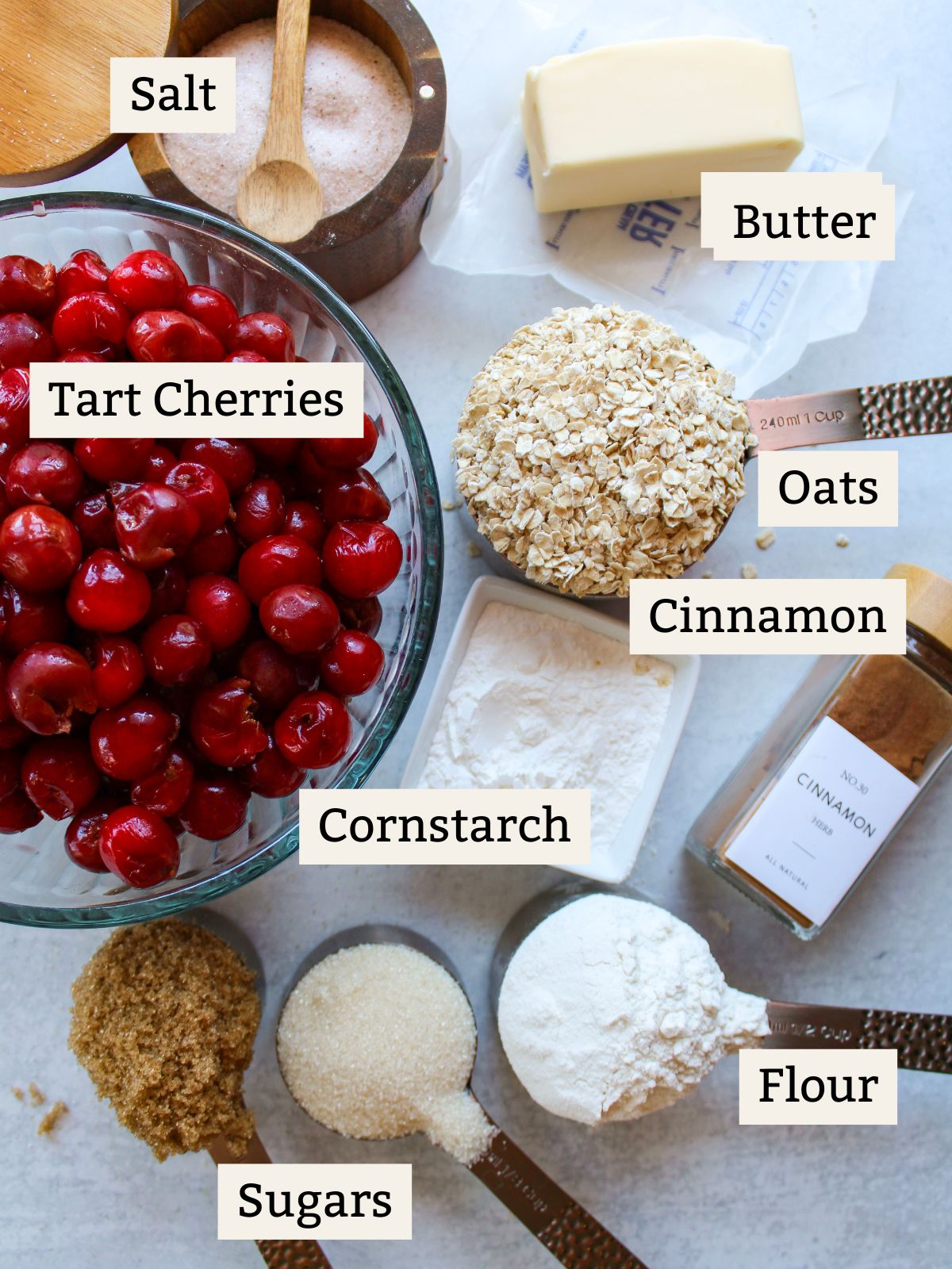 Ingredients for tart cherry crisp in measuring cups.