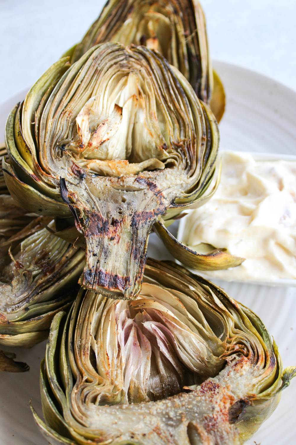 grilled artichokes on a plate