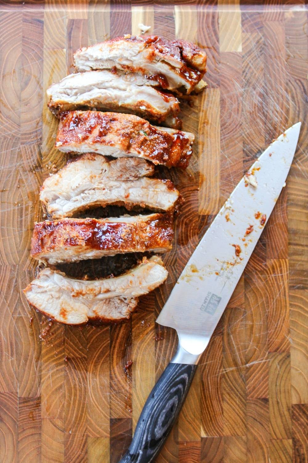 sliced ribs on a cutting board