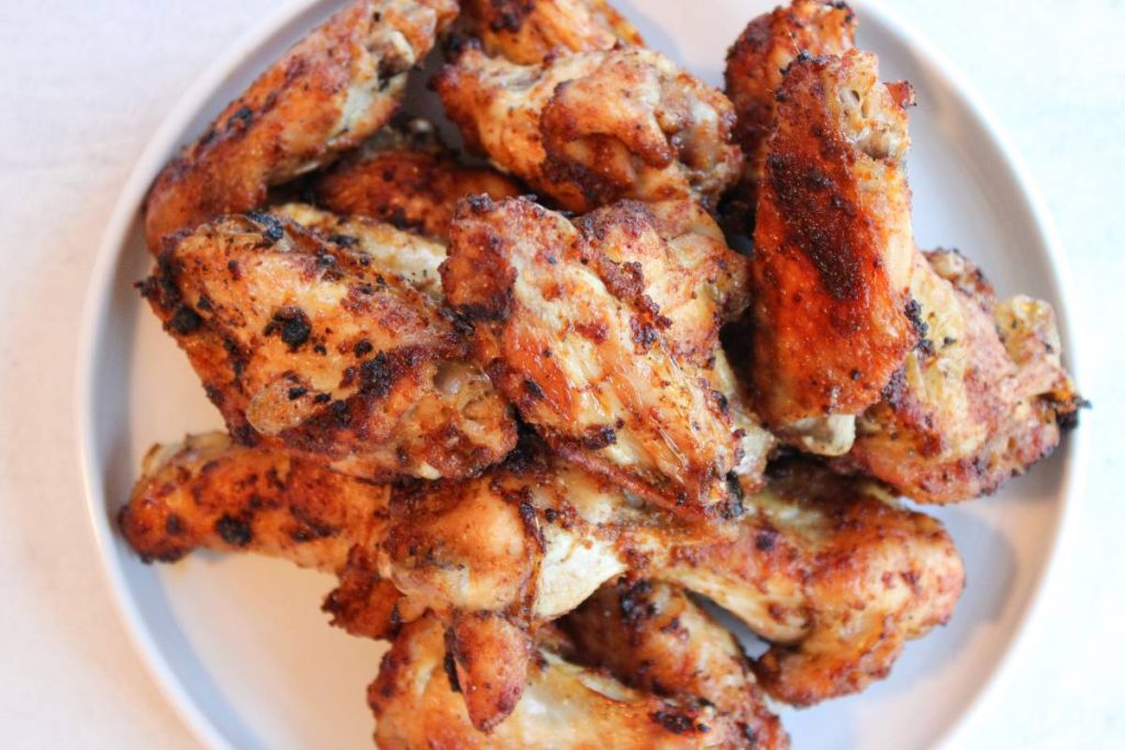 Plate of air fryer wings on a white plate