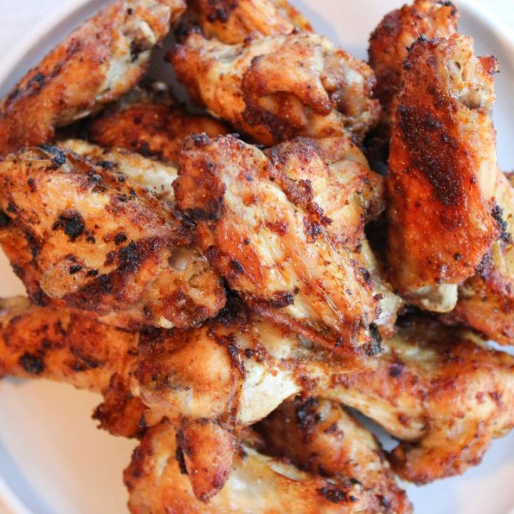 Plate of air fryer wings on a white plate