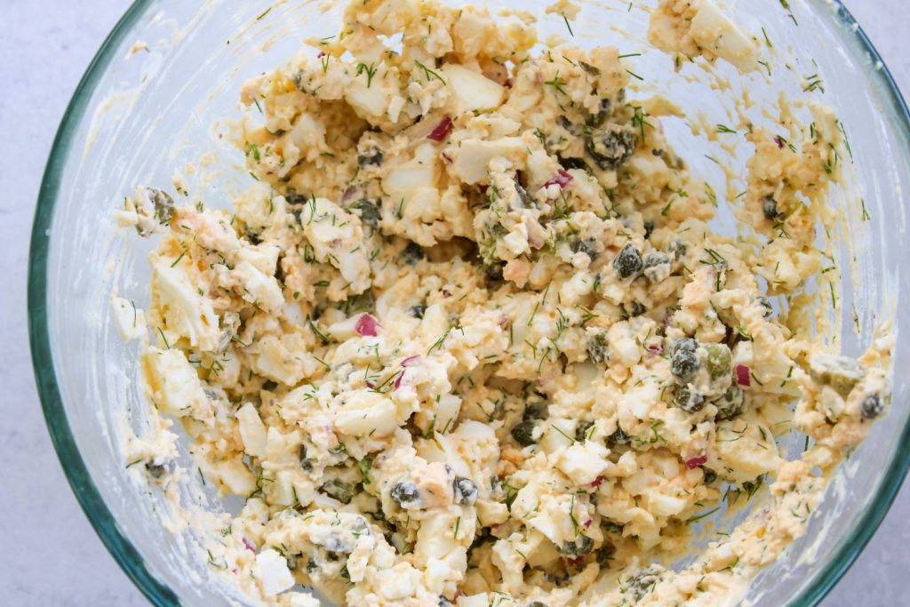 Egg salad ingredients all mixed together