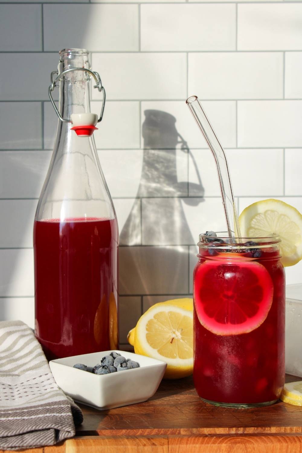 Blueberry lavender lemonade with a glass bottle filled