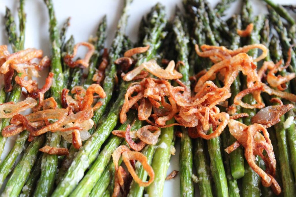 Close up of shallots on asparagus