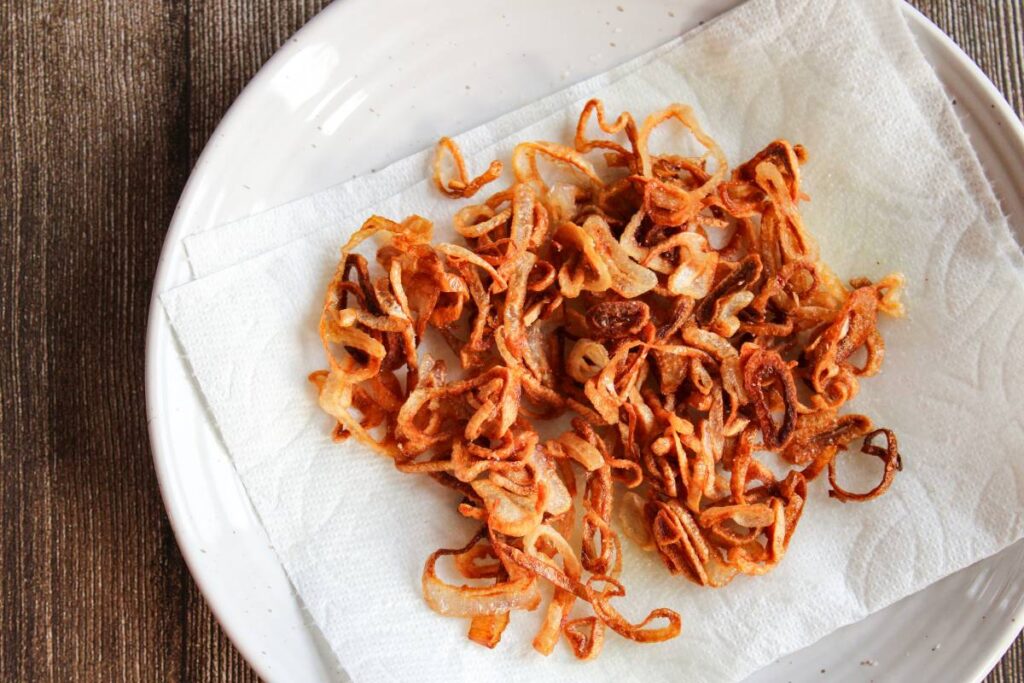 A plate of crispy shallots