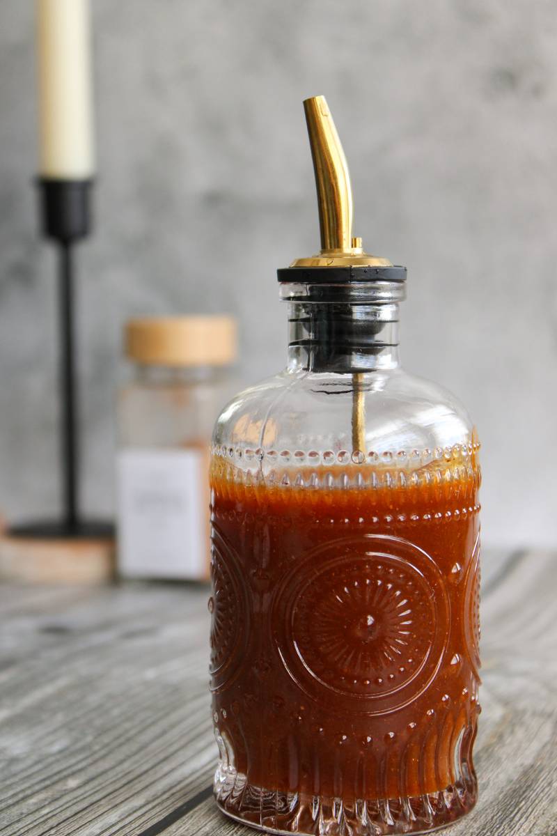 Glass jar filled with pumpkin spice syrup