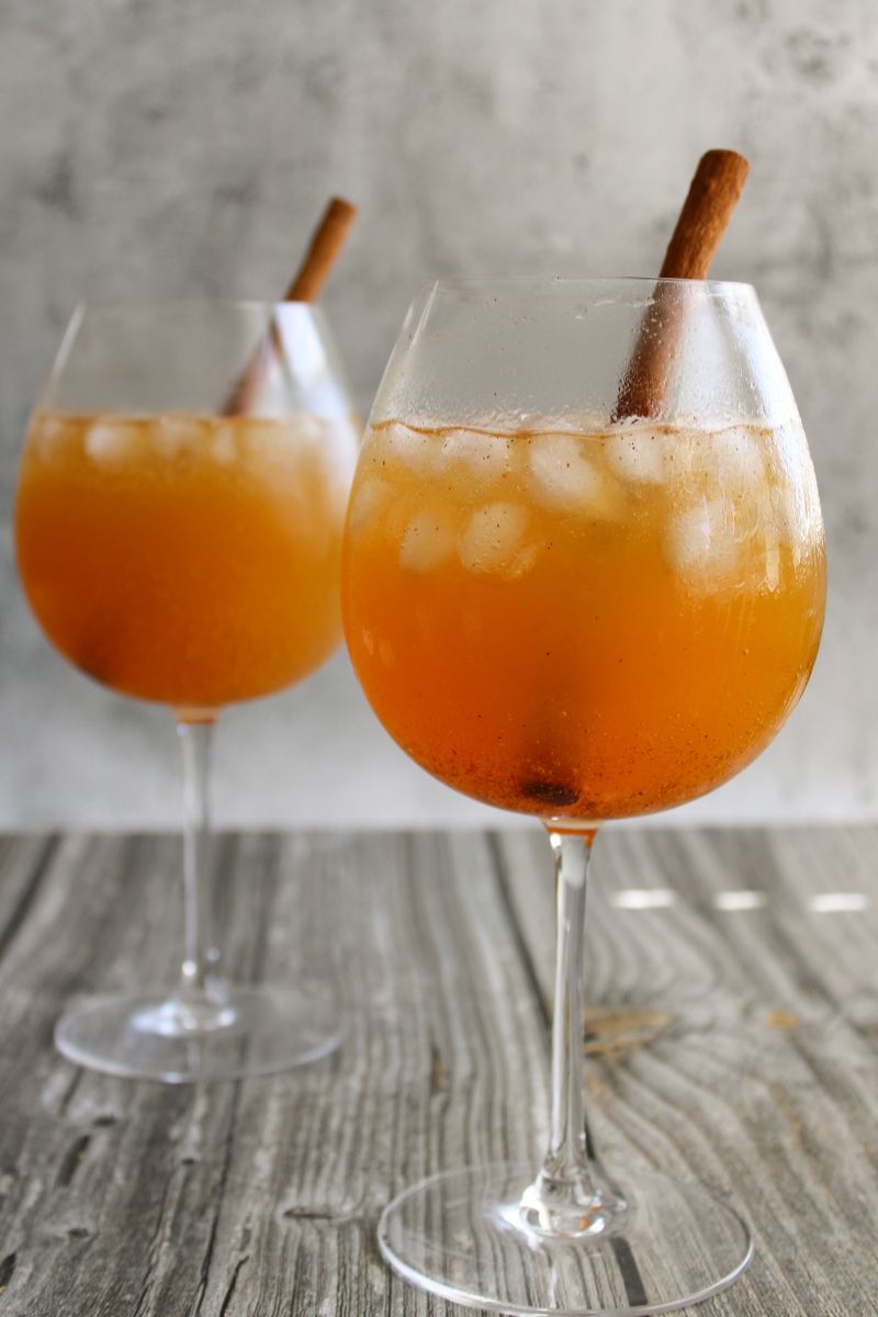 Two wine glasses filled with Pumpkin Ginger Spice Mocktail