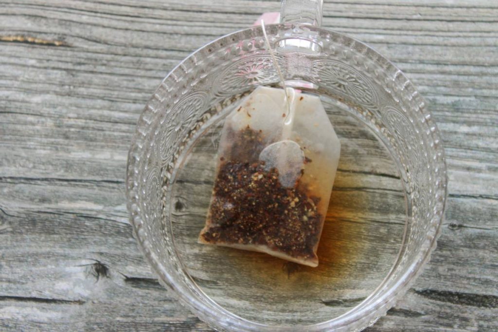 Chai tea steeping in a clear mug