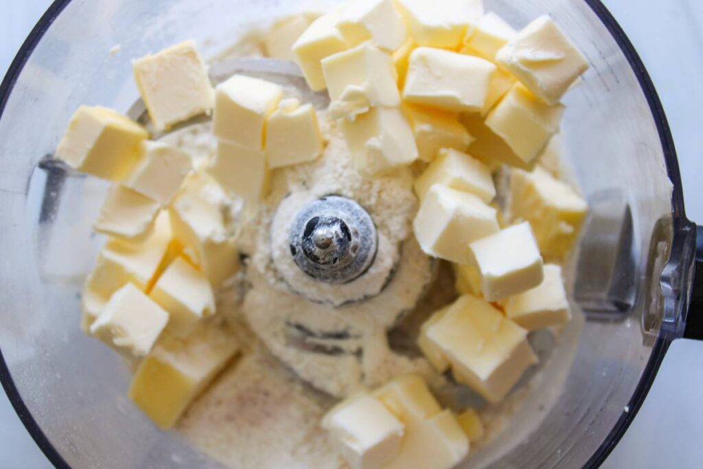 Ingredients for butter pie crust in a food processor