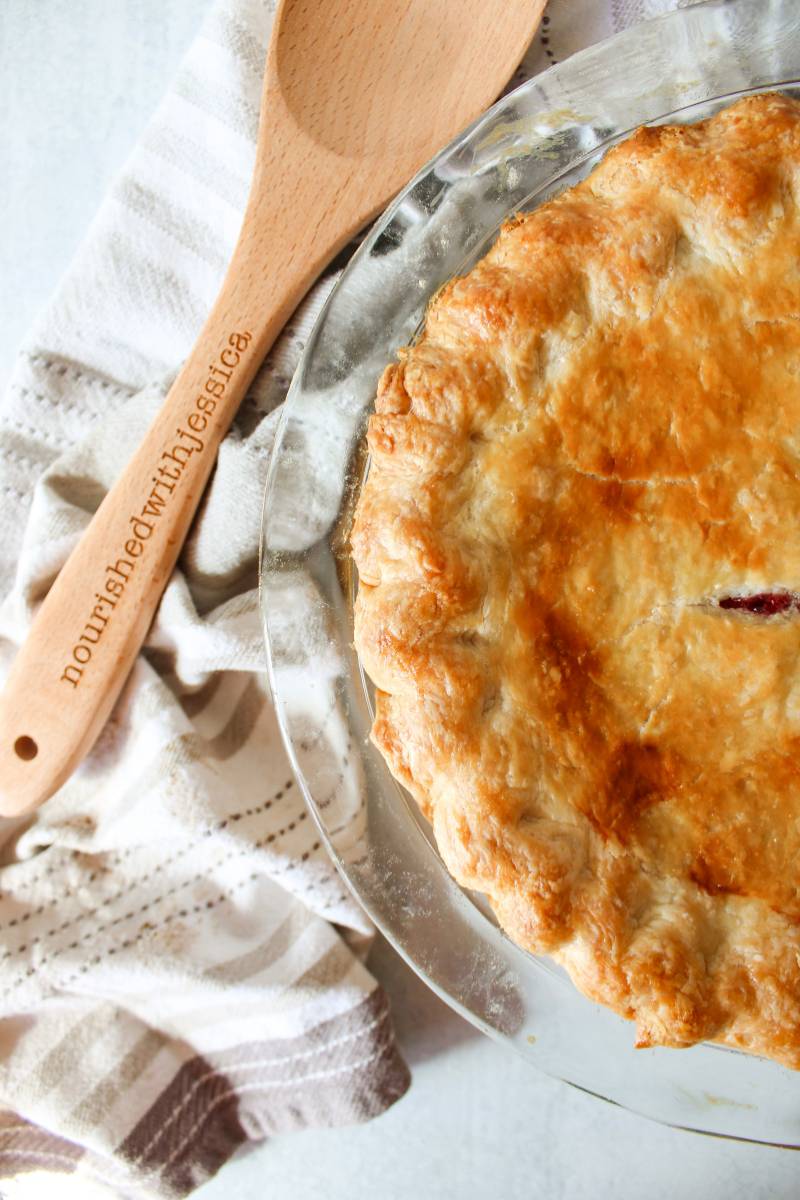 Homemade pie next to a wooden spoon