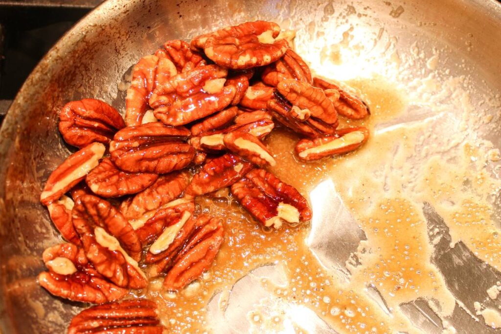 pecans with melted butter and maple syrup