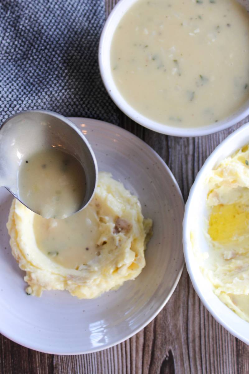 pouring gravy over mashed potatoes