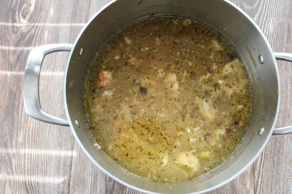 Simmered chicken stock in a pot