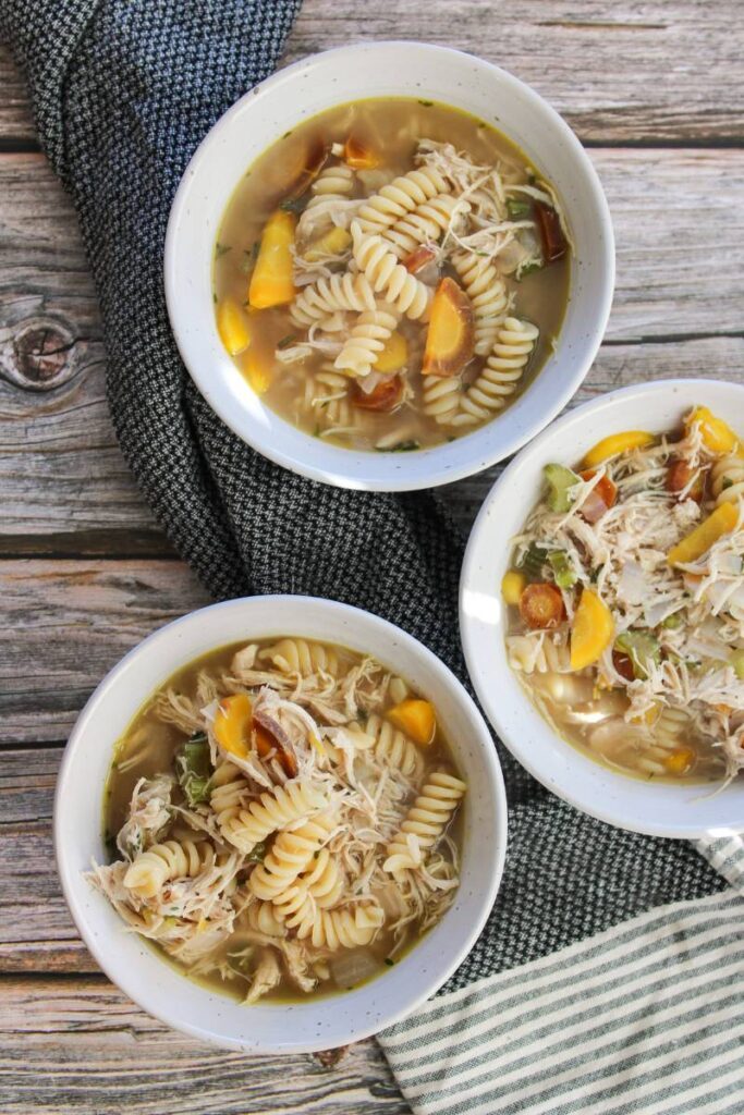 three bowls of chicken noodle soup