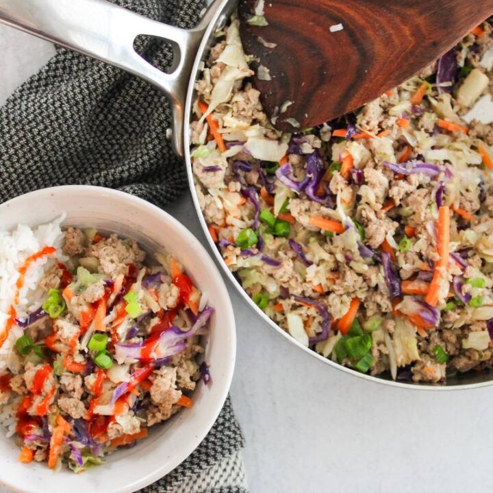 egg roll in a bowl next to skillet