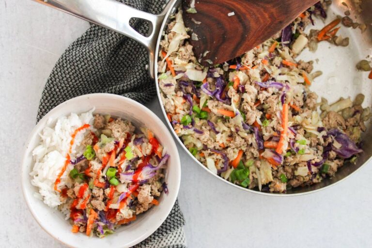 egg roll in a bowl next to skillet