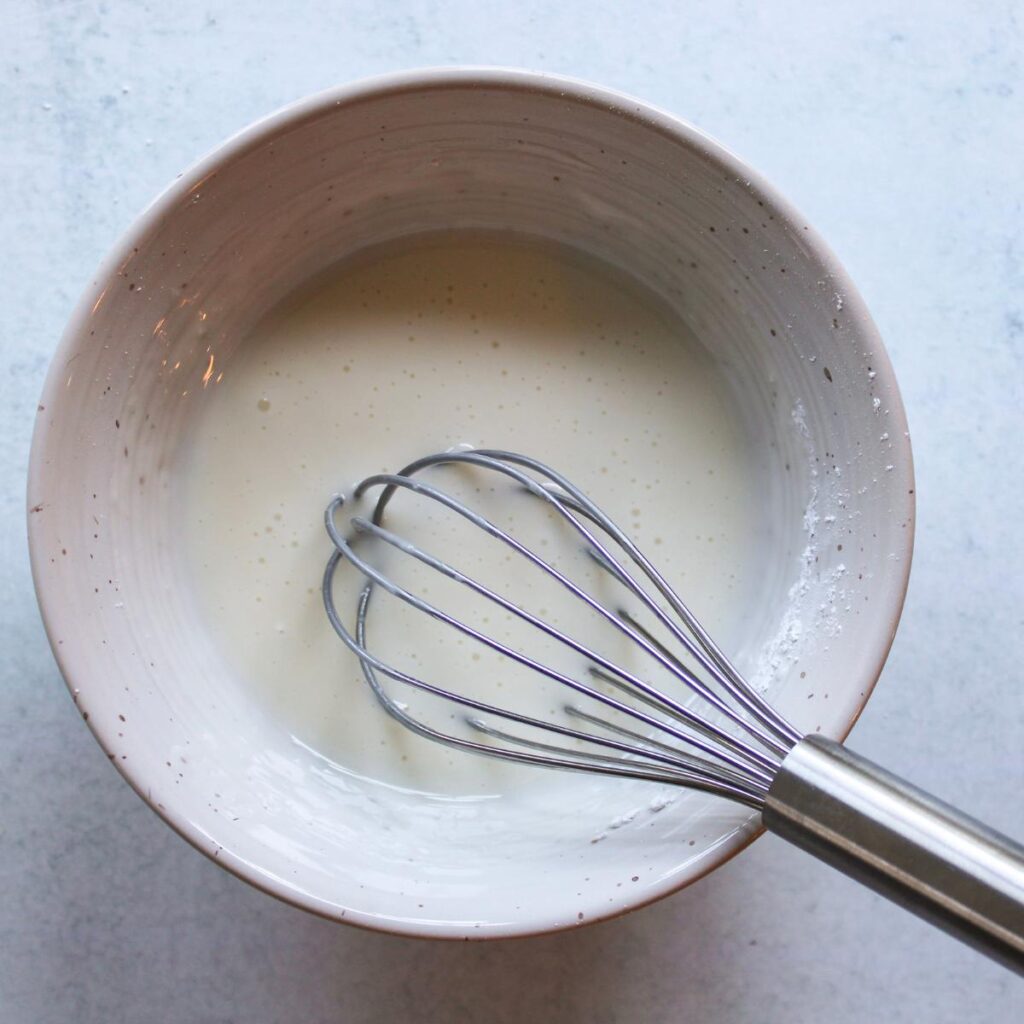 Lemon and powdered sugar whisked together in a small bowl.