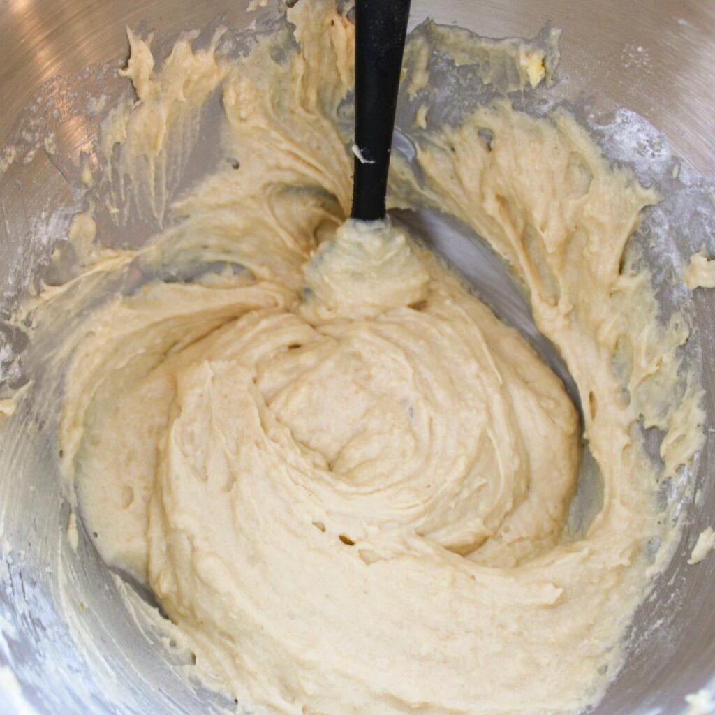 Cake batter in a stand mixer bowl.