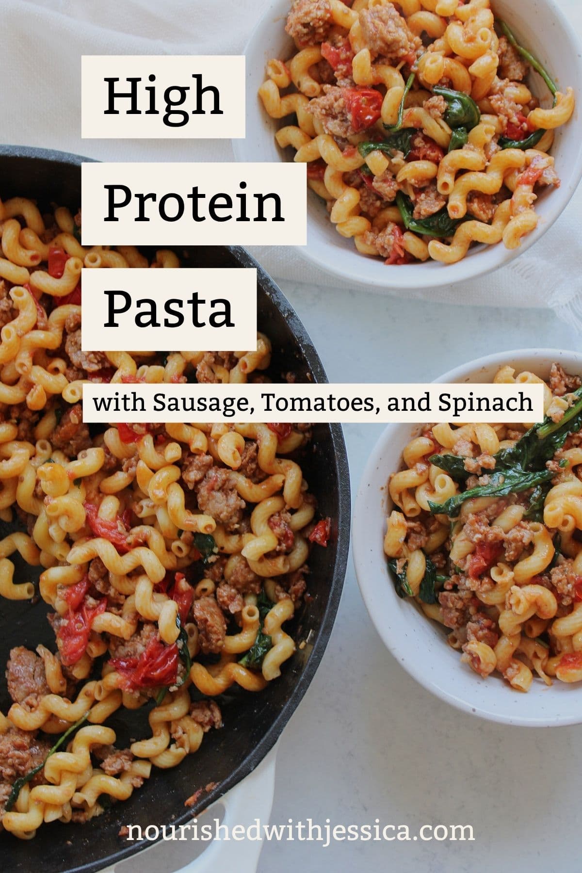 High protein pasta with Italian sausage, fresh tomatoes and spinach in a skillet next to two bowls filled with the pasta.