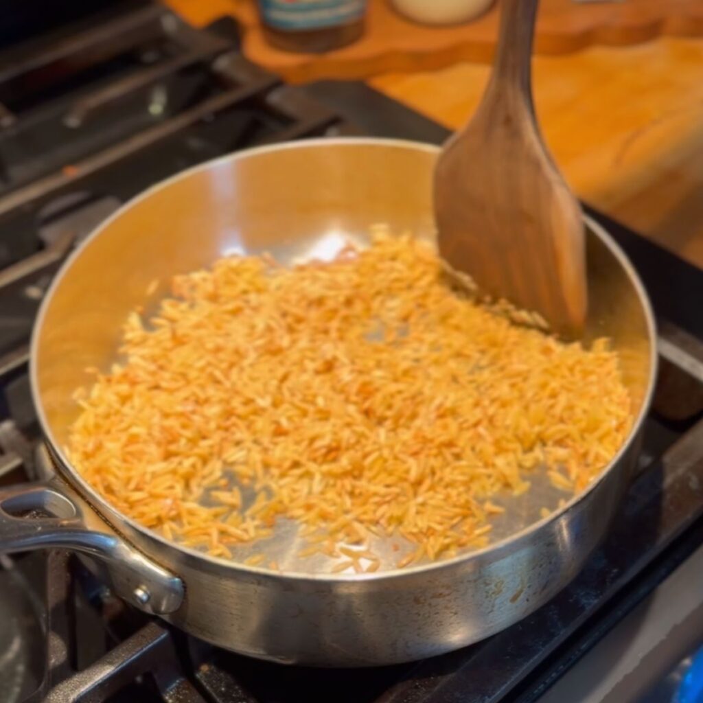Toasting orzo in a medium saucepan in butter and garlic.