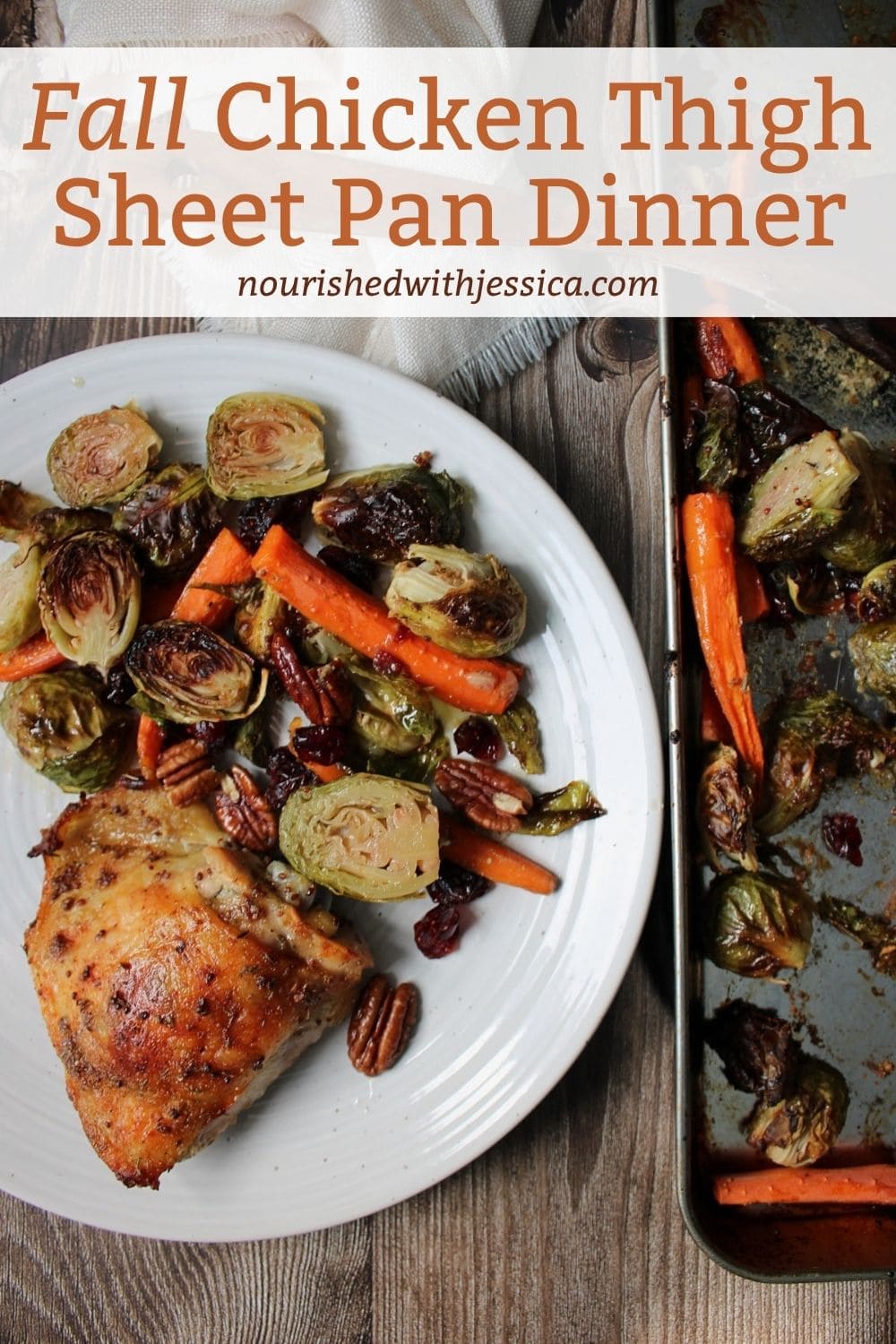 Crispy chicken thighs with caramelized Brussels sprouts and carrots tossed in a maple mustard sauce with pecans and dried cranberries on a sheet pan next to a plate of food.