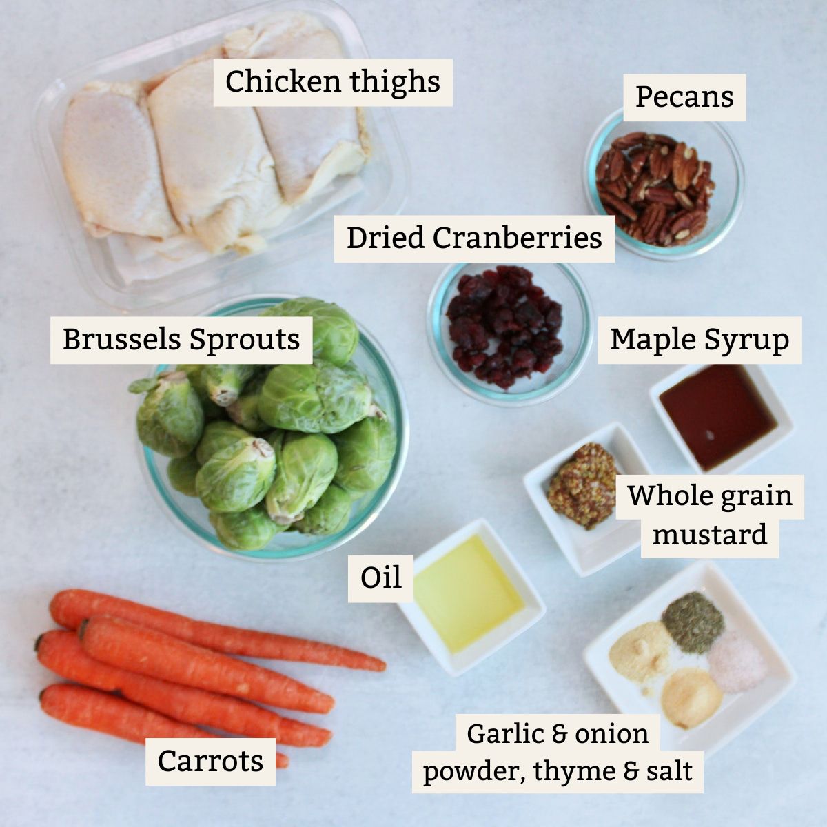 Ingredients for fall chicken thigh sheet pan dinner recipe on a white background.