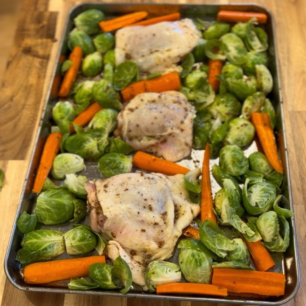 Fall chicken thighs sheet pan dinner on a sheet pan before baking.